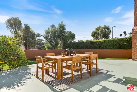 a view of a tables and chairs on the terrace
