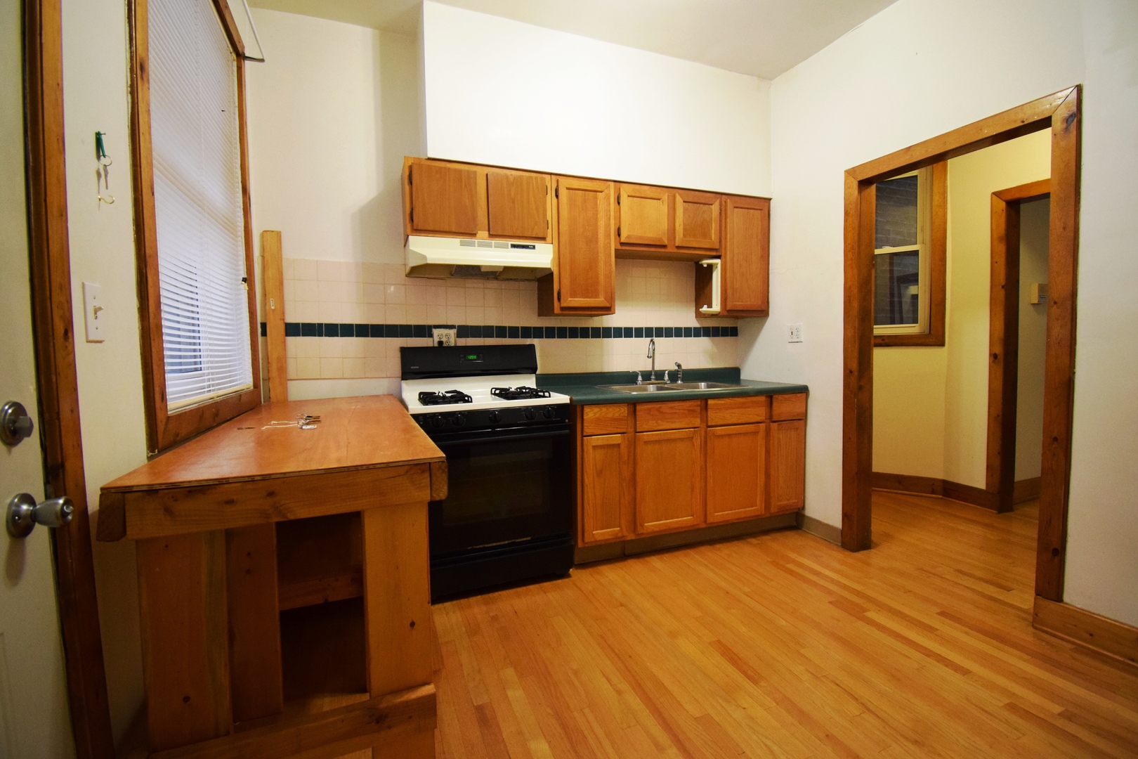 4326 North Kenmore Avenue, Unit 1 Chicago, IL 60613 - Photo 12 of 14 a kitchen with stainless steel appliances granite countertop a stove a sink and a microwave
