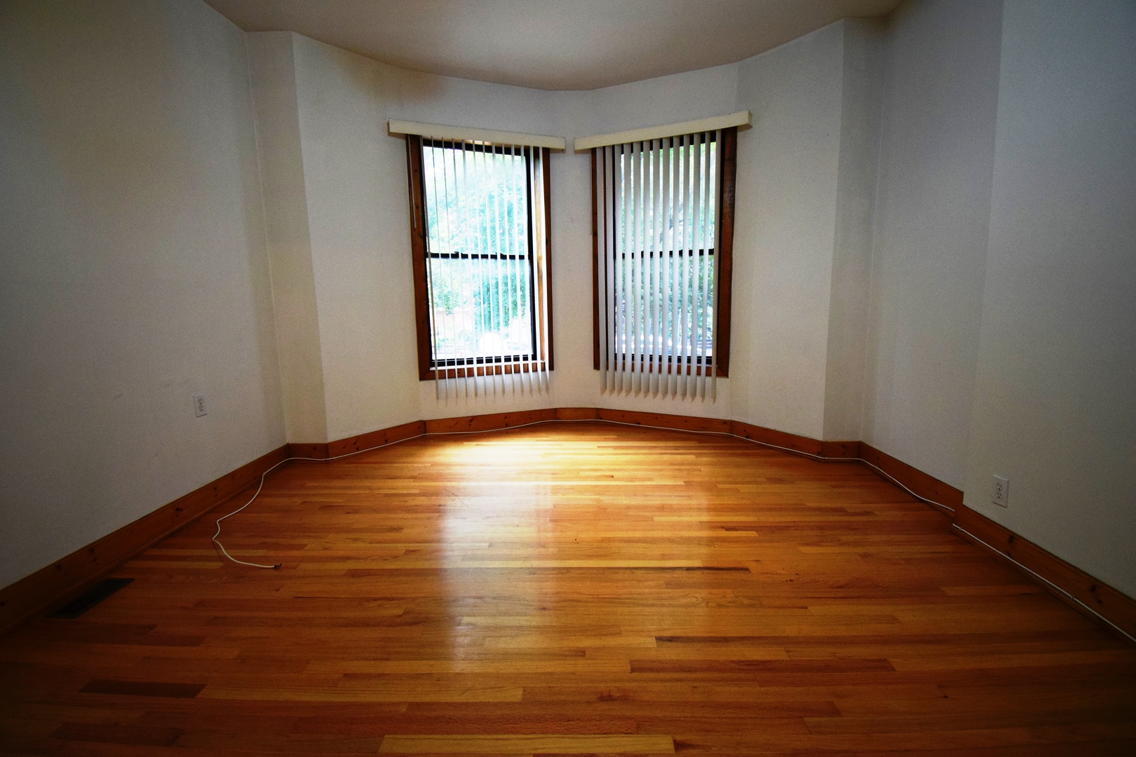 4326 North Kenmore Avenue, Unit 1 Chicago, IL 60613 - Photo 4 of 14 a view of empty room with wooden floor and fan
