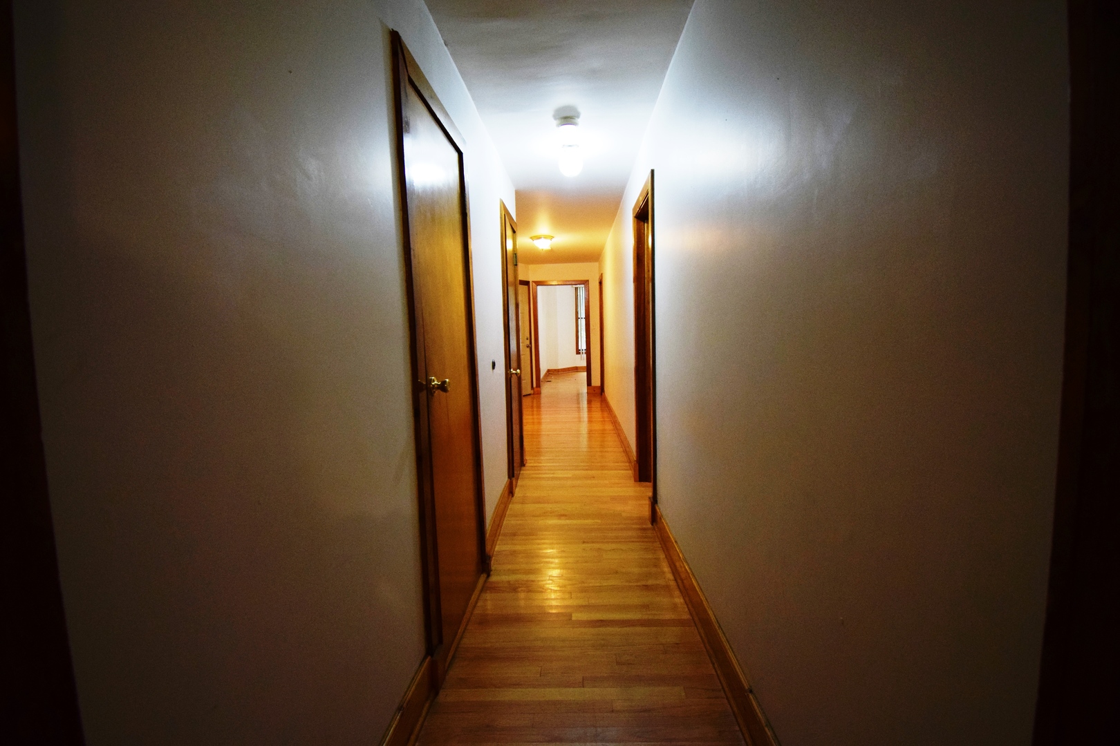 4326 North Kenmore Avenue, Unit 1 Chicago, IL 60613 - Photo 6 of 14 a view of a hallway with wooden floor