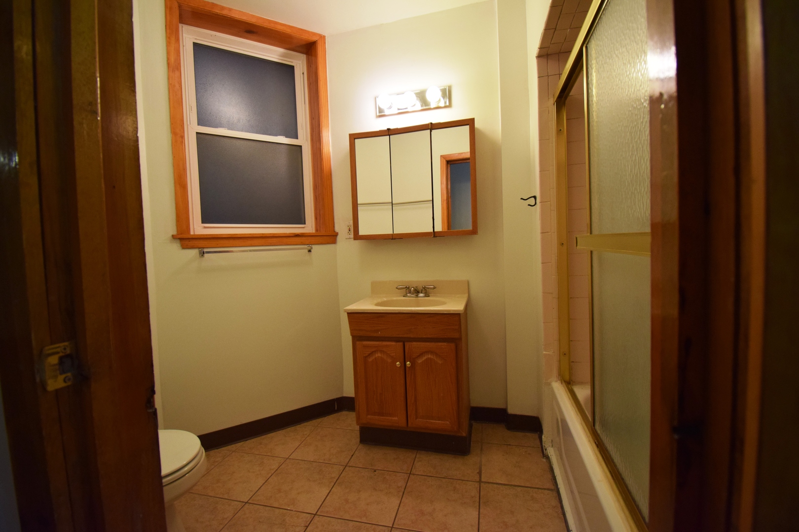 4326 North Kenmore Avenue, Unit 1 Chicago, IL 60613 - Photo 7 of 14 a bathroom with a sink and a mirror