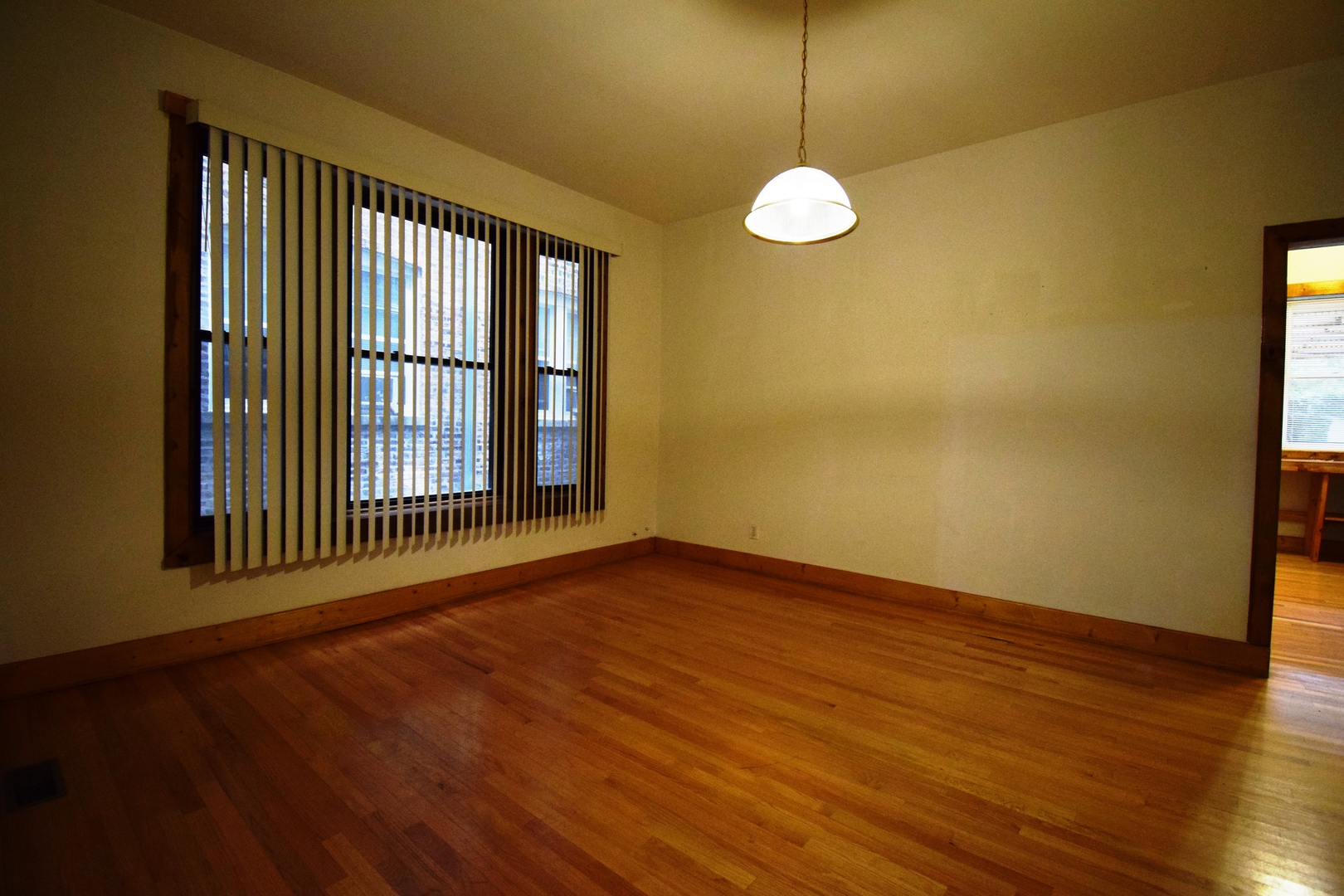4326 North Kenmore Avenue, Unit 1 Chicago, IL 60613 - Photo 9 of 14 a view of a room with wooden floor and a window