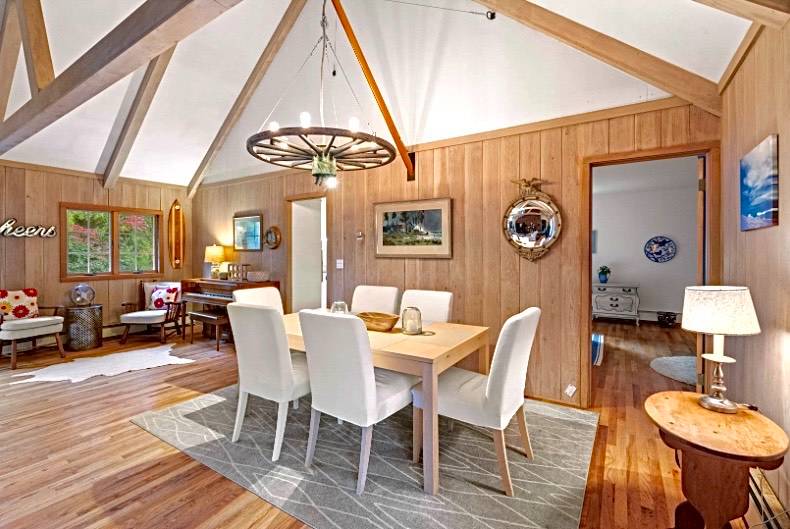32 Surf Drive Amagansett, NY 11930 - Photo 3 of 14 a view of a dining room with furniture and wooden floor