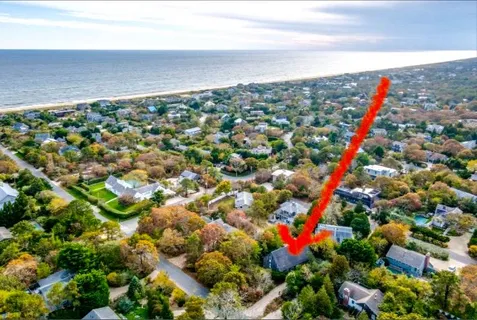a bedroom with two beds and a couch