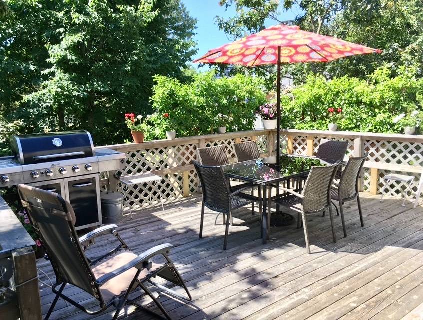 32 Surf Drive Amagansett, NY 11930 - Photo 7 of 14 a view of a dinning tables and chairs in the patio
