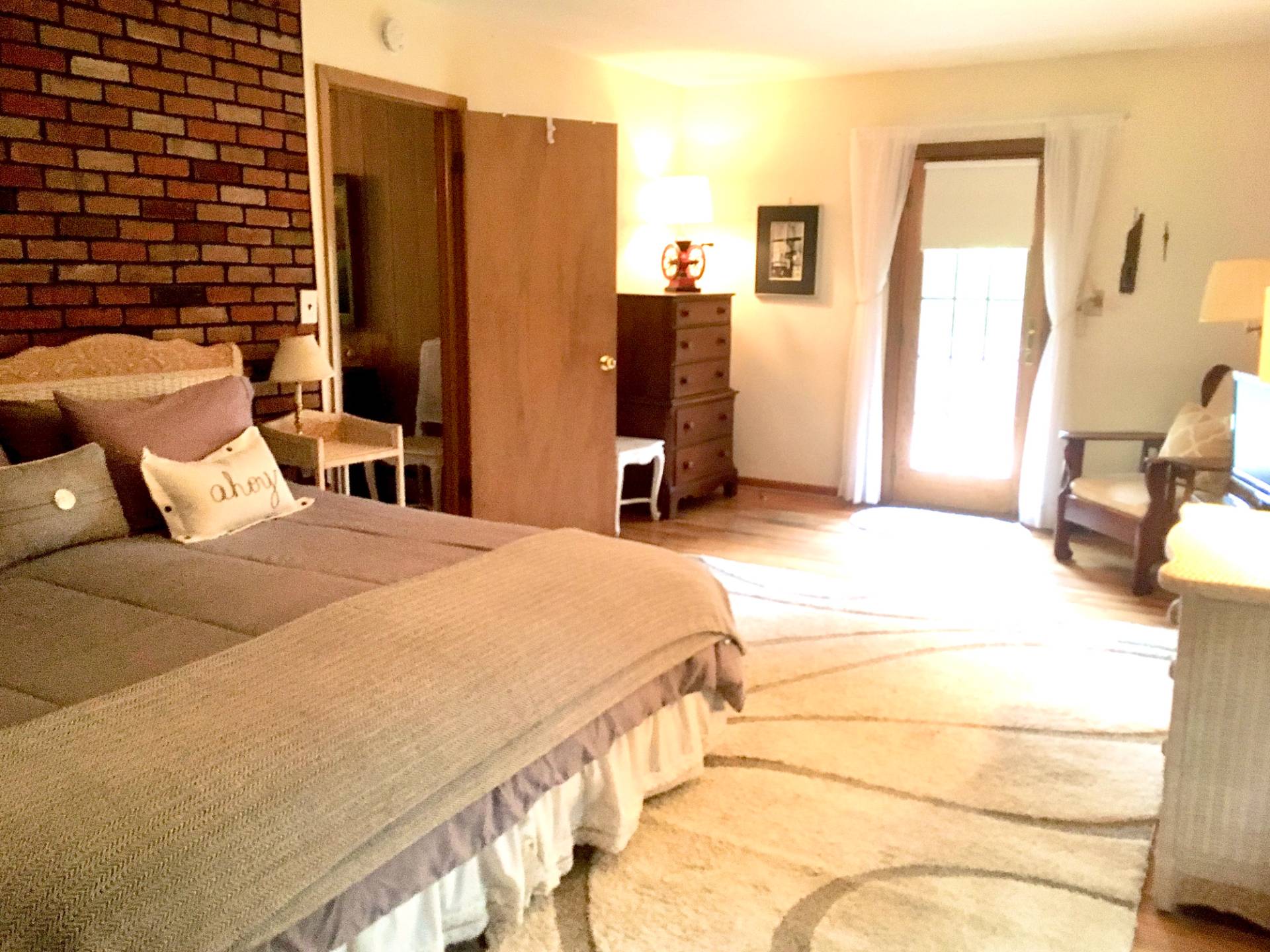 32 Surf Drive Amagansett, NY 11930 - Photo 9 of 14 a bedroom with a bed and wooden floor