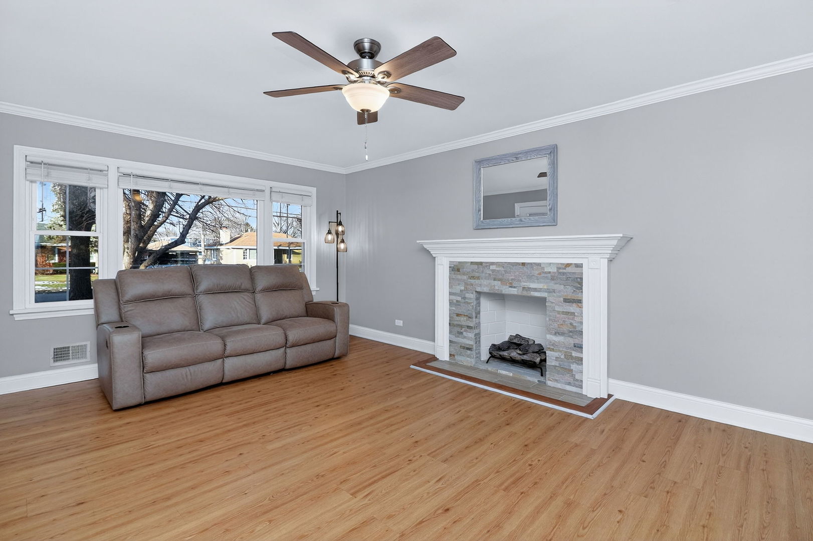 5825 West 109th Street Chicago Ridge, IL 60415 - Photo 3 of 17 a living room with furniture and a fireplace