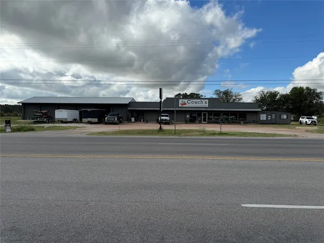 a view of a car is parked on the road with house