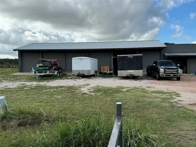 a view of a car park in front of house