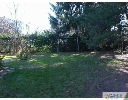 33 Burnham Road East Brunswick, NJ 08816 - Photo 1 of 7 a backyard of a house with lots of green space