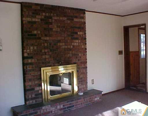 33 Burnham Road East Brunswick, NJ 08816 - Photo 5 of 7 a room with fireplace