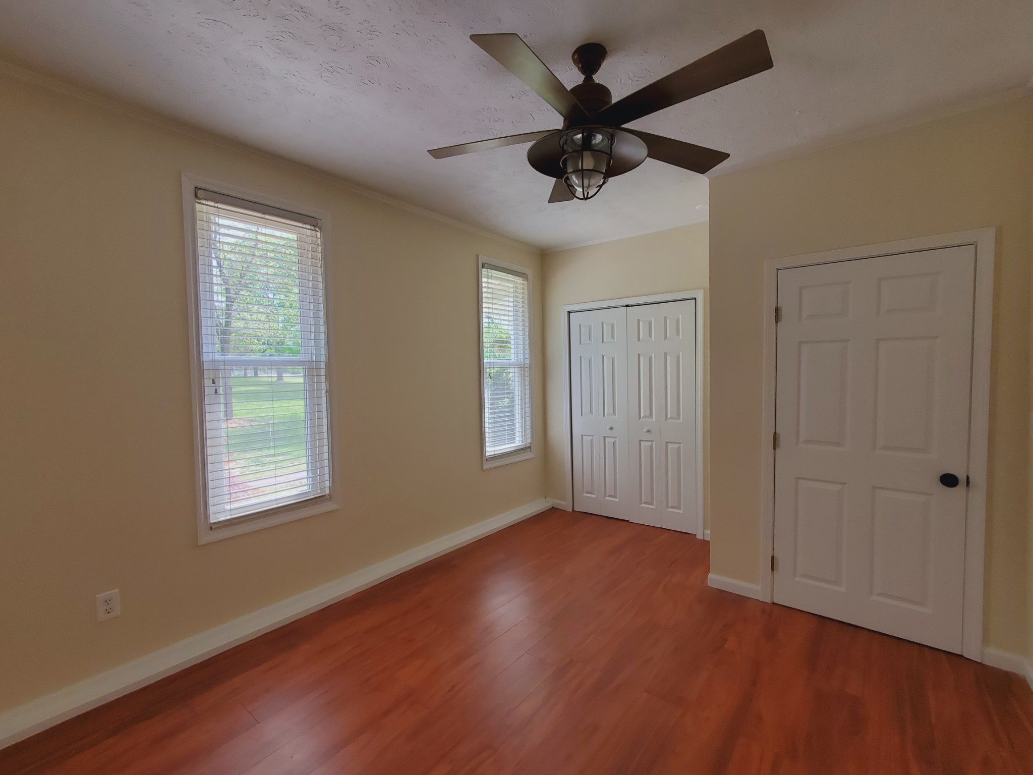 324 West Harper Road Portland, TN 37148 - Photo 17 of 25 a view of an empty room with wooden floor and a window
