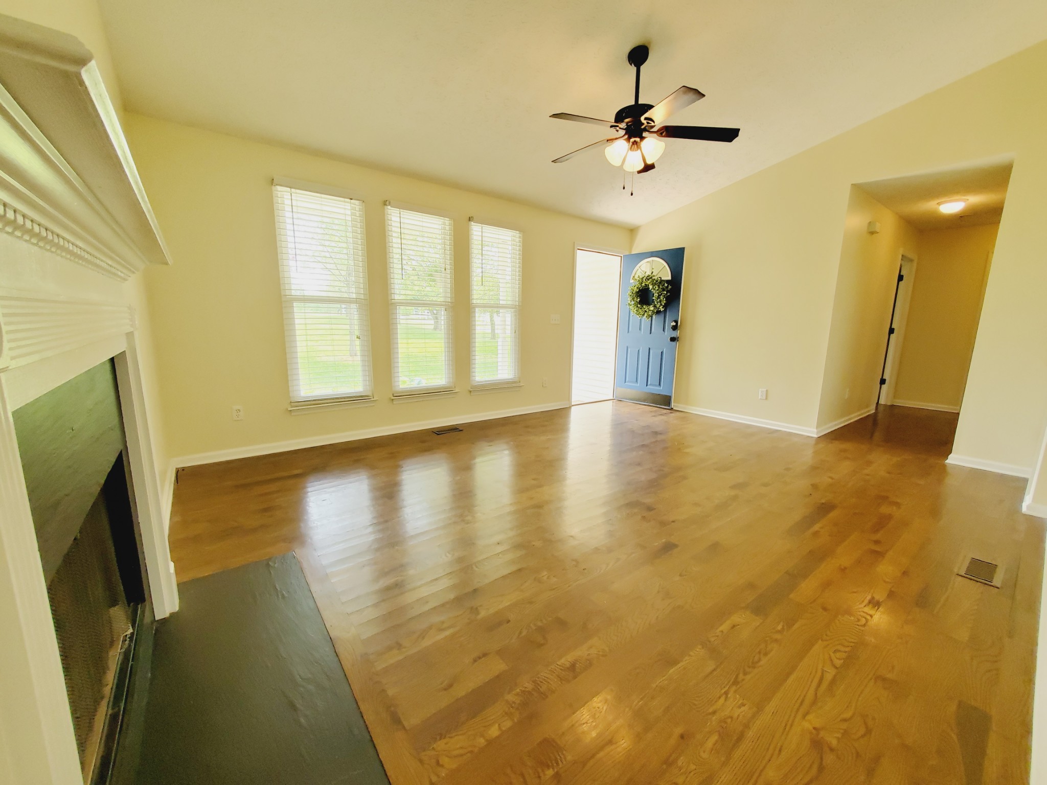 324 West Harper Road Portland, TN 37148 - Photo 2 of 25 a view of an empty room with window and a kitchen