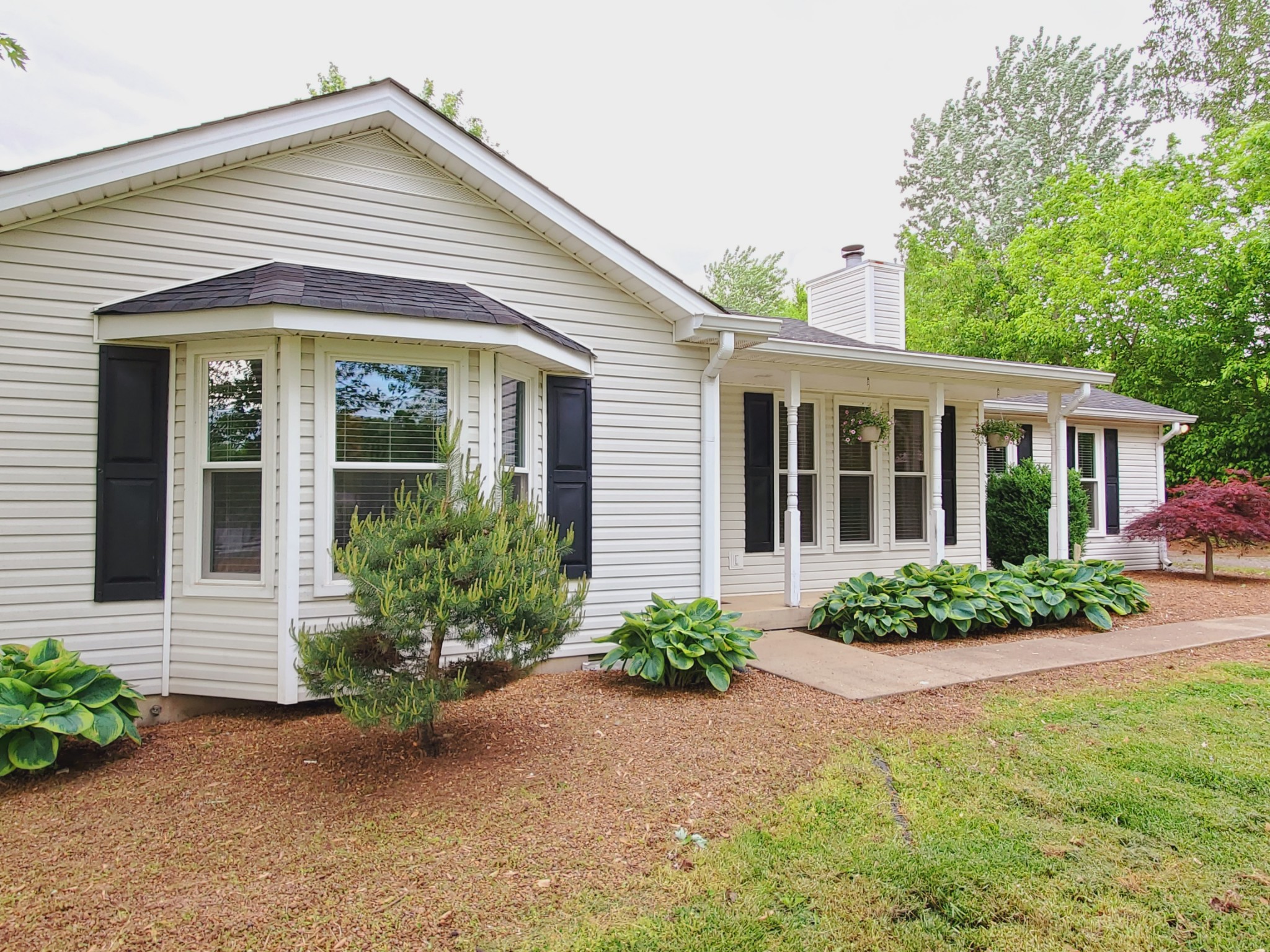 324 West Harper Road Portland, TN 37148 - Photo 25 of 25 a front view of a house with garden
