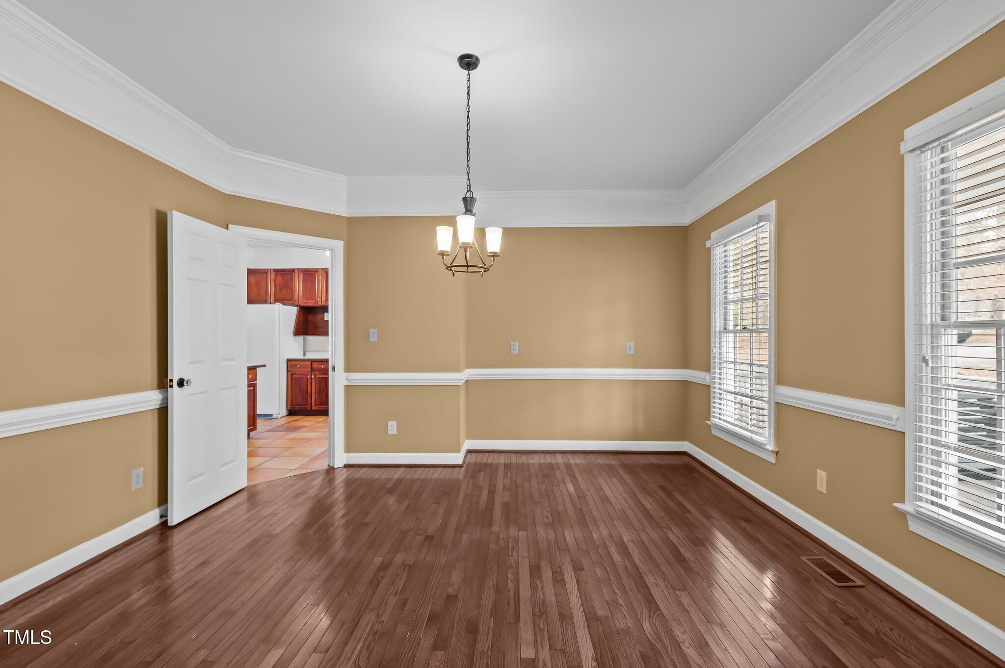 2517 Mt Vernon Church Road Raleigh, NC 27614 - Photo 12 of 45 a view of empty room with wooden floor and fan