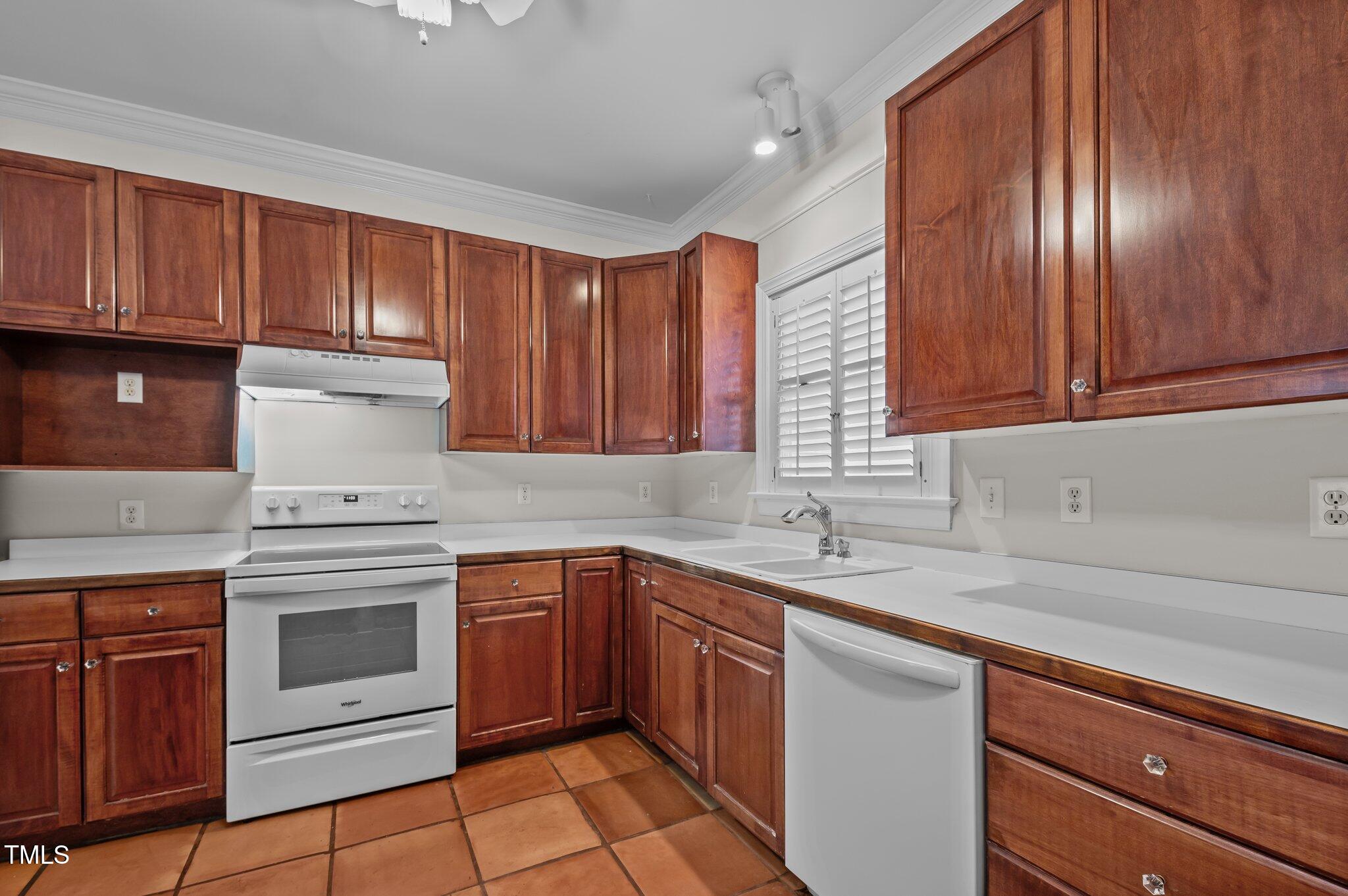2517 Mt Vernon Church Road Raleigh, NC 27614 - Photo 14 of 45 a kitchen with granite countertop stainless steel appliances wooden cabinets and a sink