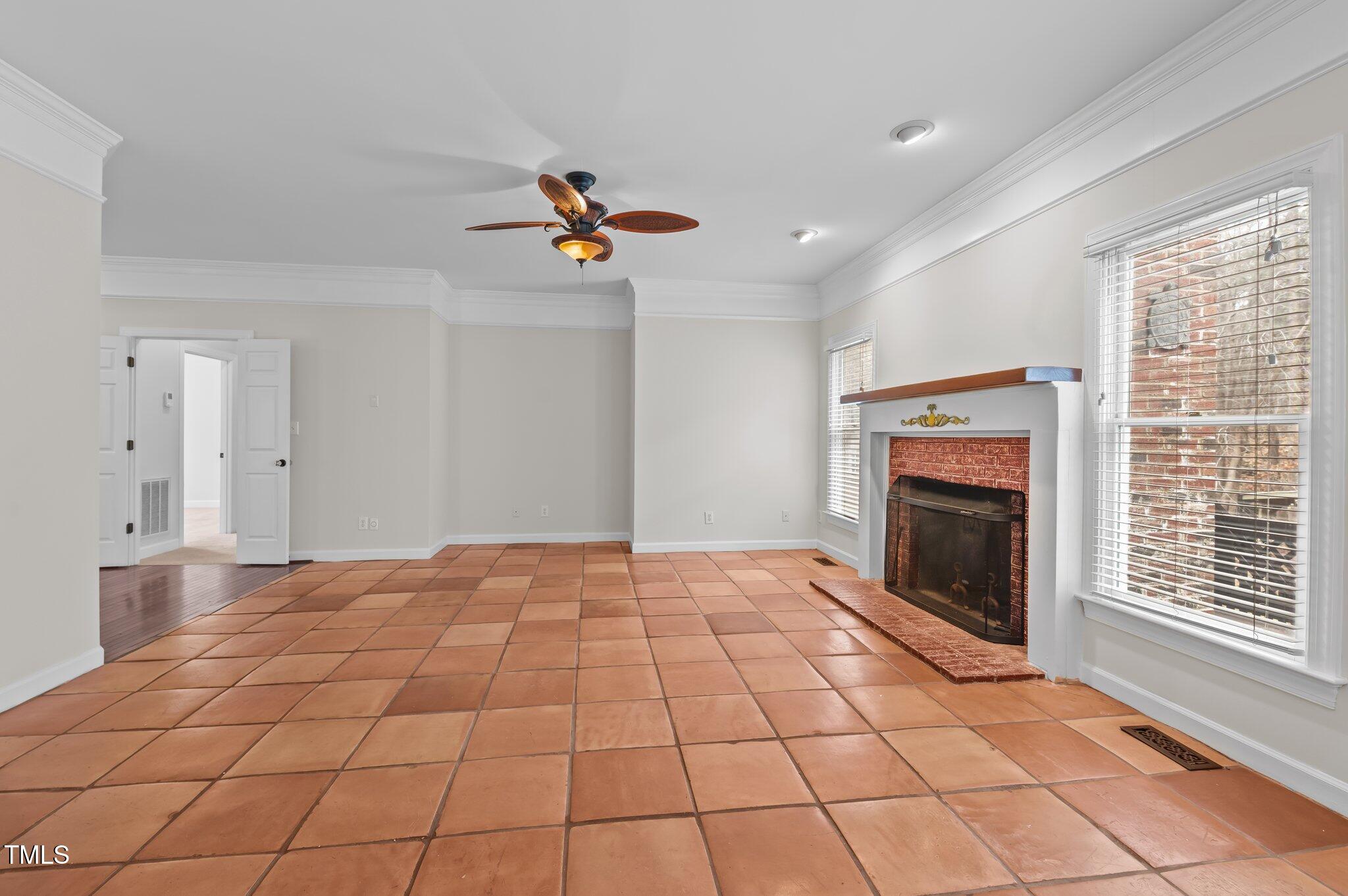 2517 Mt Vernon Church Road Raleigh, NC 27614 - Photo 17 of 45 a view of an empty room with a fireplace and a window