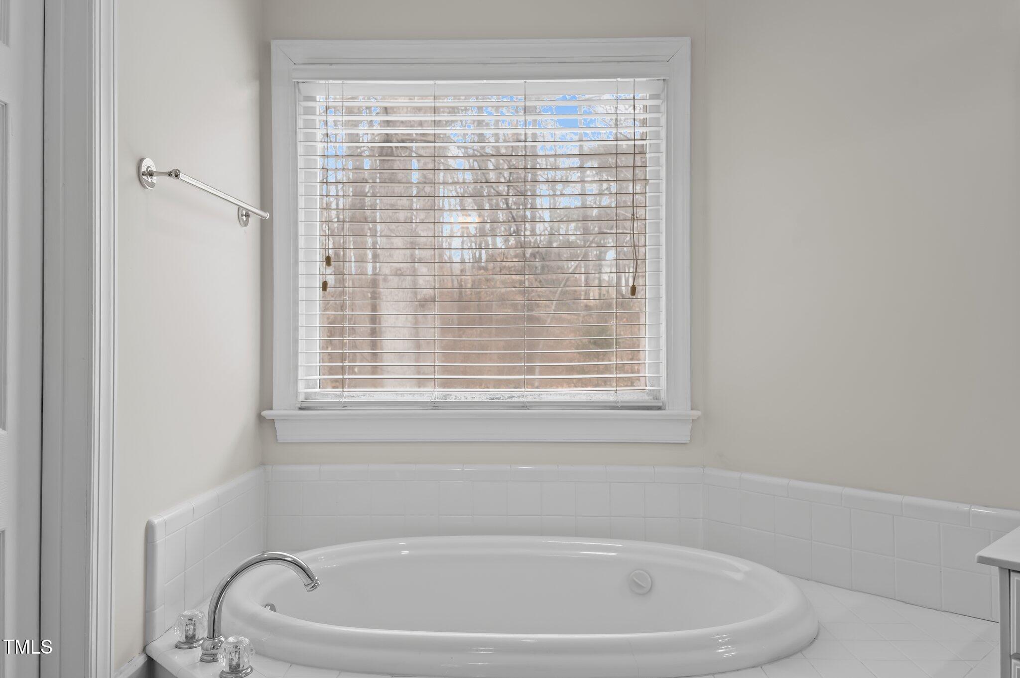 2517 Mt Vernon Church Road Raleigh, NC 27614 - Photo 23 of 45 a white bath tub sitting next to a window