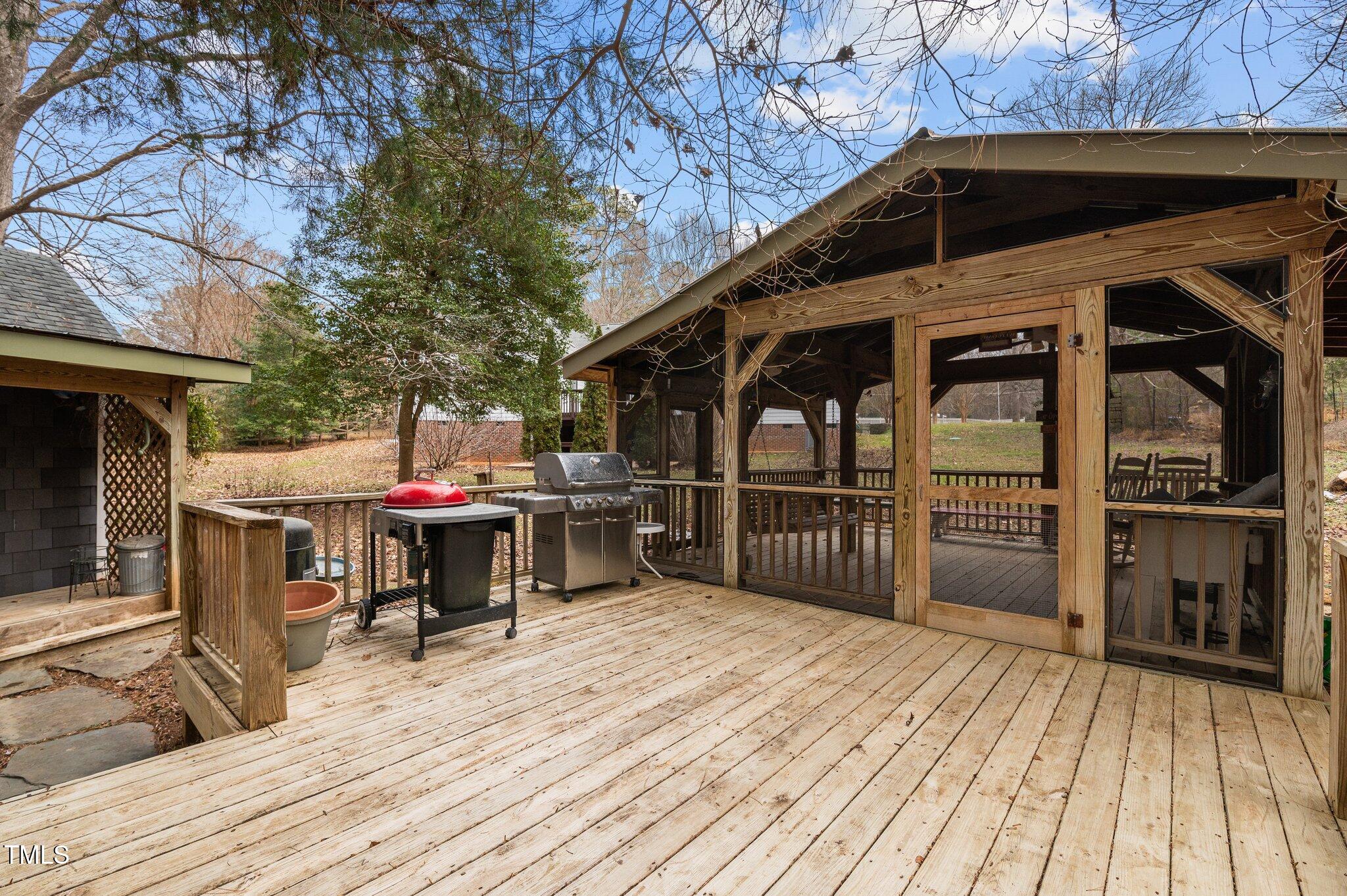 2517 Mt Vernon Church Road Raleigh, NC 27614 - Photo 41 of 45 a view of a deck with table and chairs with wooden floor and fence