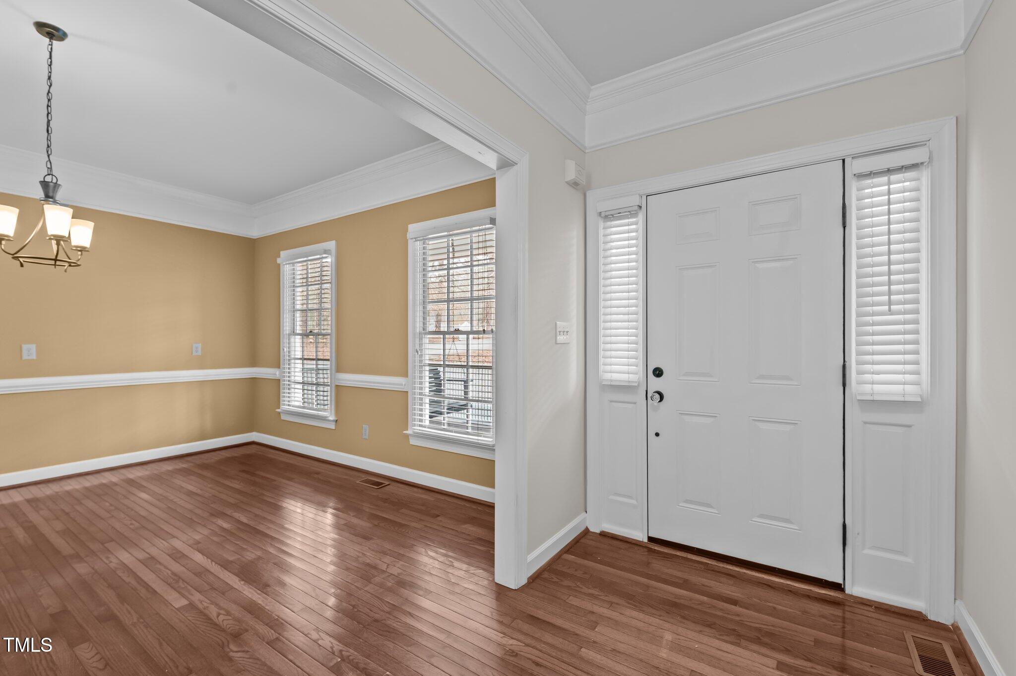 2517 Mt Vernon Church Road Raleigh, NC 27614 - Photo 10 of 45 wooden floor in an empty room with a window