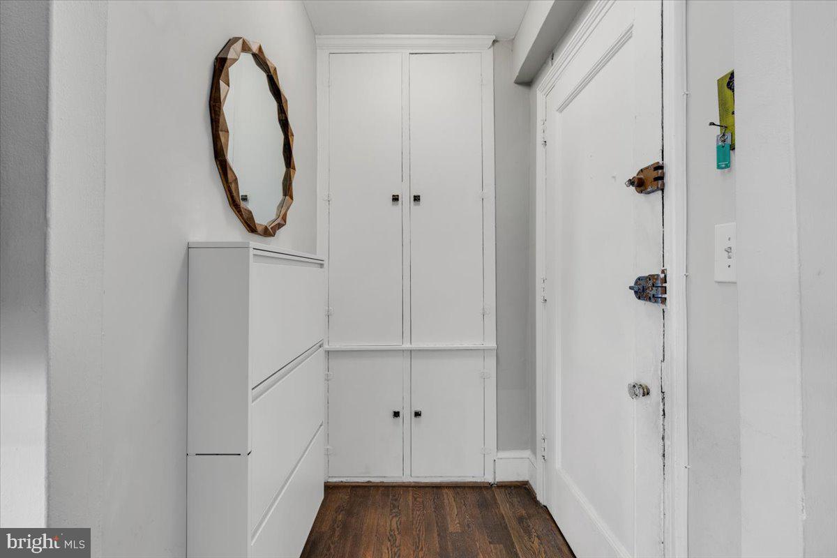 1301 Longfellow Street Northwest, Unit 207 Washington, DC 20011 - Photo 13 of 25 a view of a hallway with wooden floor