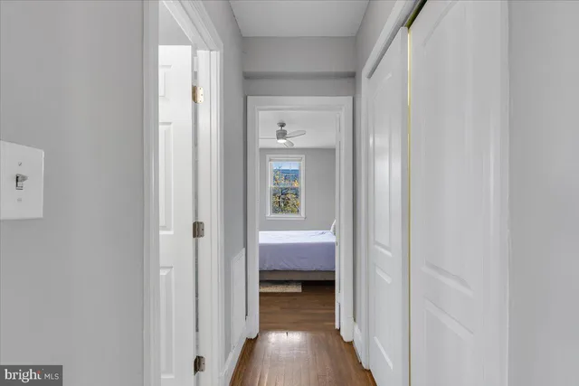 a view of bedroom with wooden floor