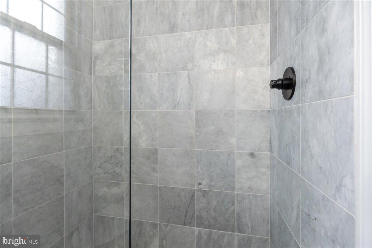 1301 Longfellow Street Northwest, Unit 207 Washington, DC 20011 - Photo 16 of 25 a bathroom with a shower