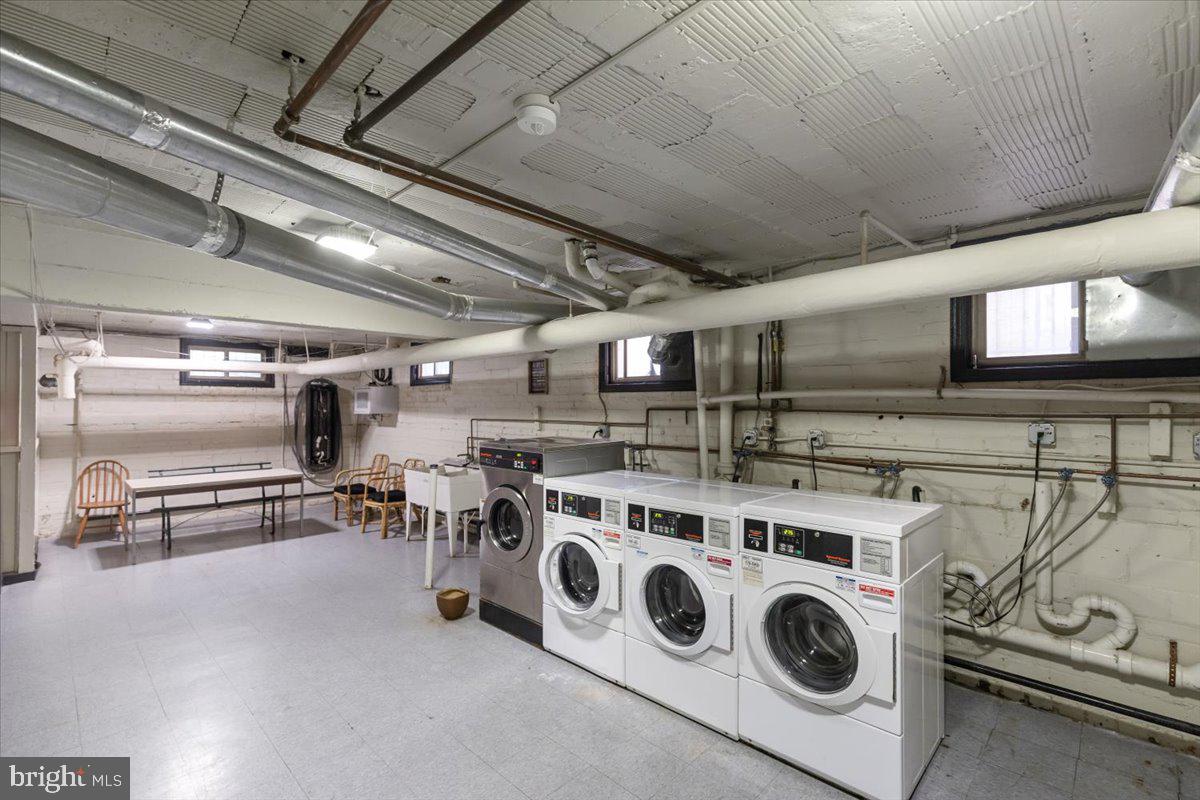 1301 Longfellow Street Northwest, Unit 207 Washington, DC 20011 - Photo 23 of 25 a view of a storage & utility room with washer and dryer