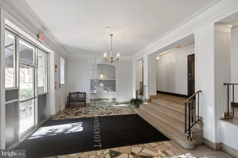 a large kitchen with granite countertop a stove a sink and a refrigerator