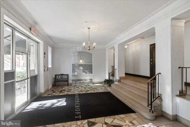 a large kitchen with granite countertop a stove a sink and a refrigerator