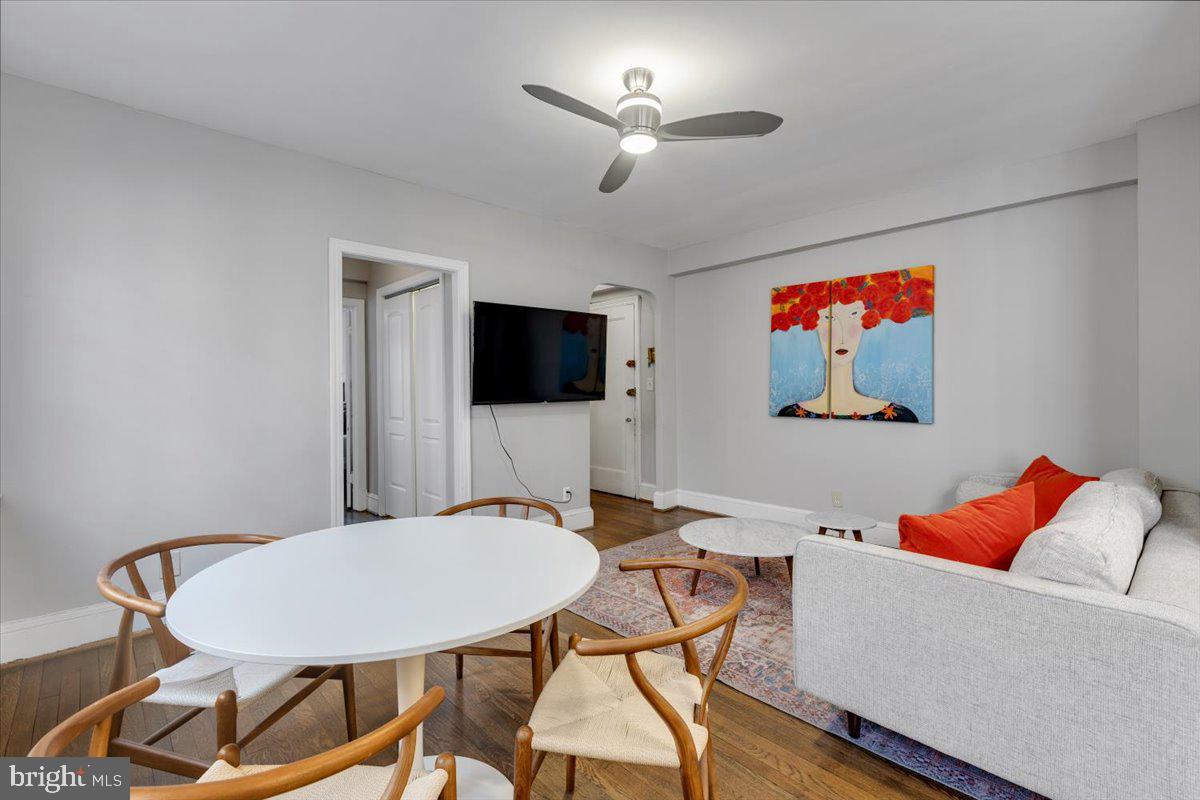 1301 Longfellow Street Northwest, Unit 207 Washington, DC 20011 - Photo 5 of 25 a living room with furniture and a flat screen tv