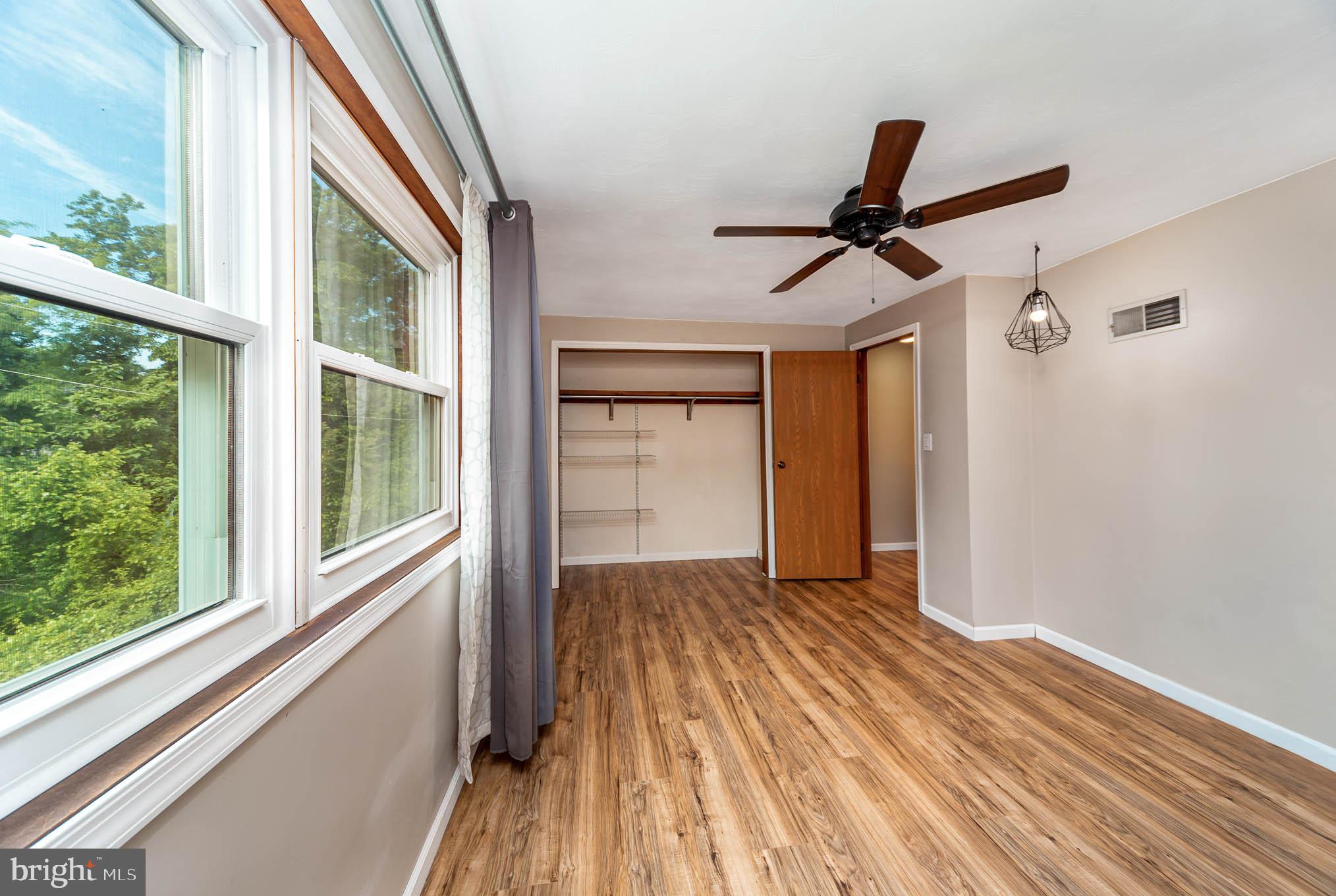 568 Valley Road Enola, PA 17025 - Photo 11 of 27 a view of a livingroom with wooden floor and a window