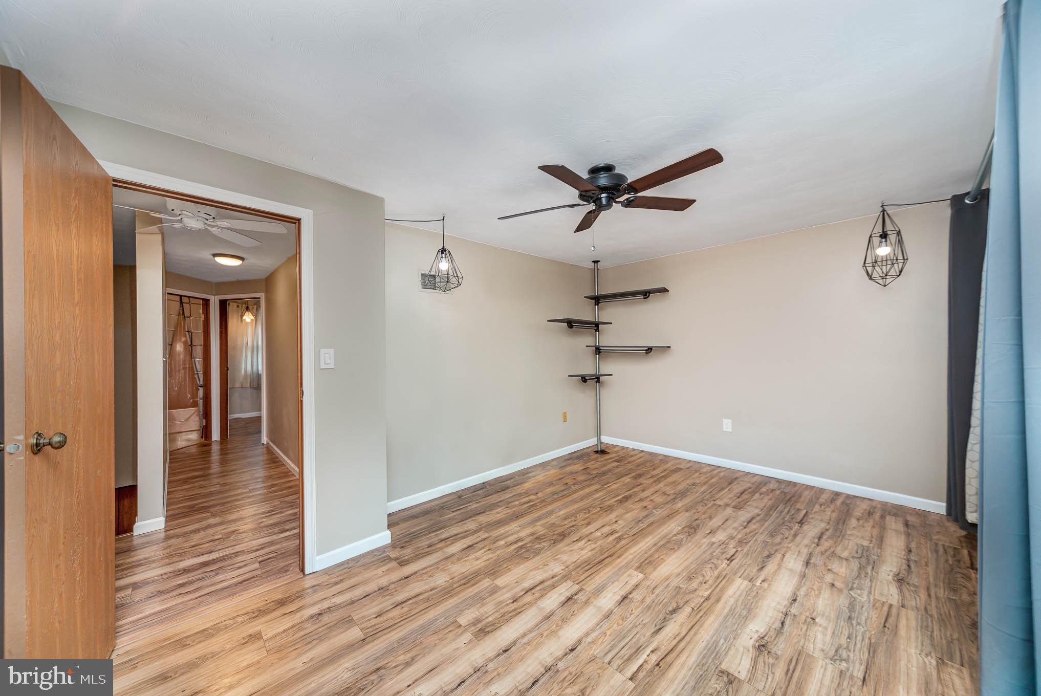 568 Valley Road Enola, PA 17025 - Photo 12 of 27 wooden floor in an empty room