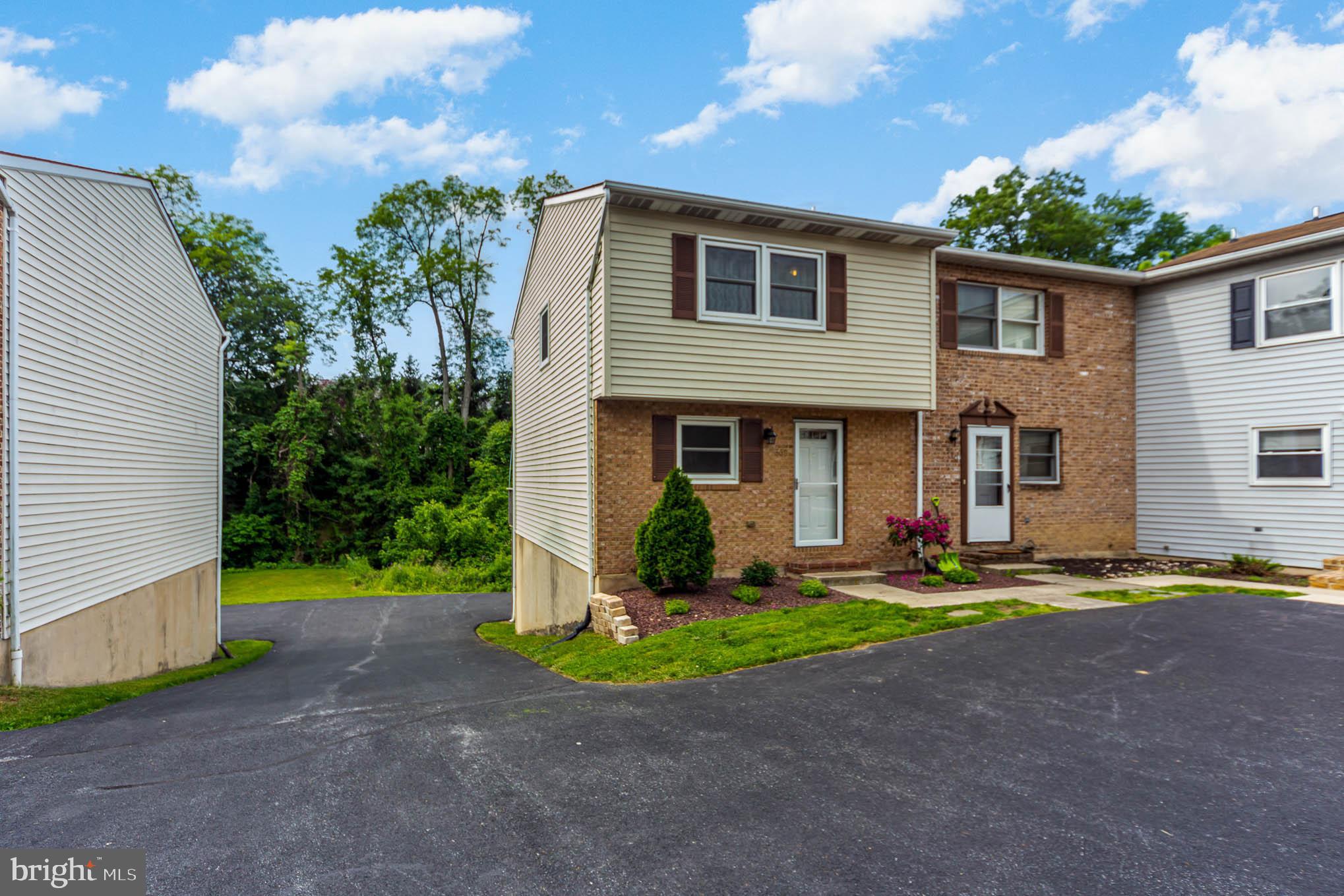 568 Valley Road Enola, PA 17025 - Photo 26 of 27 a front view of a house with garden