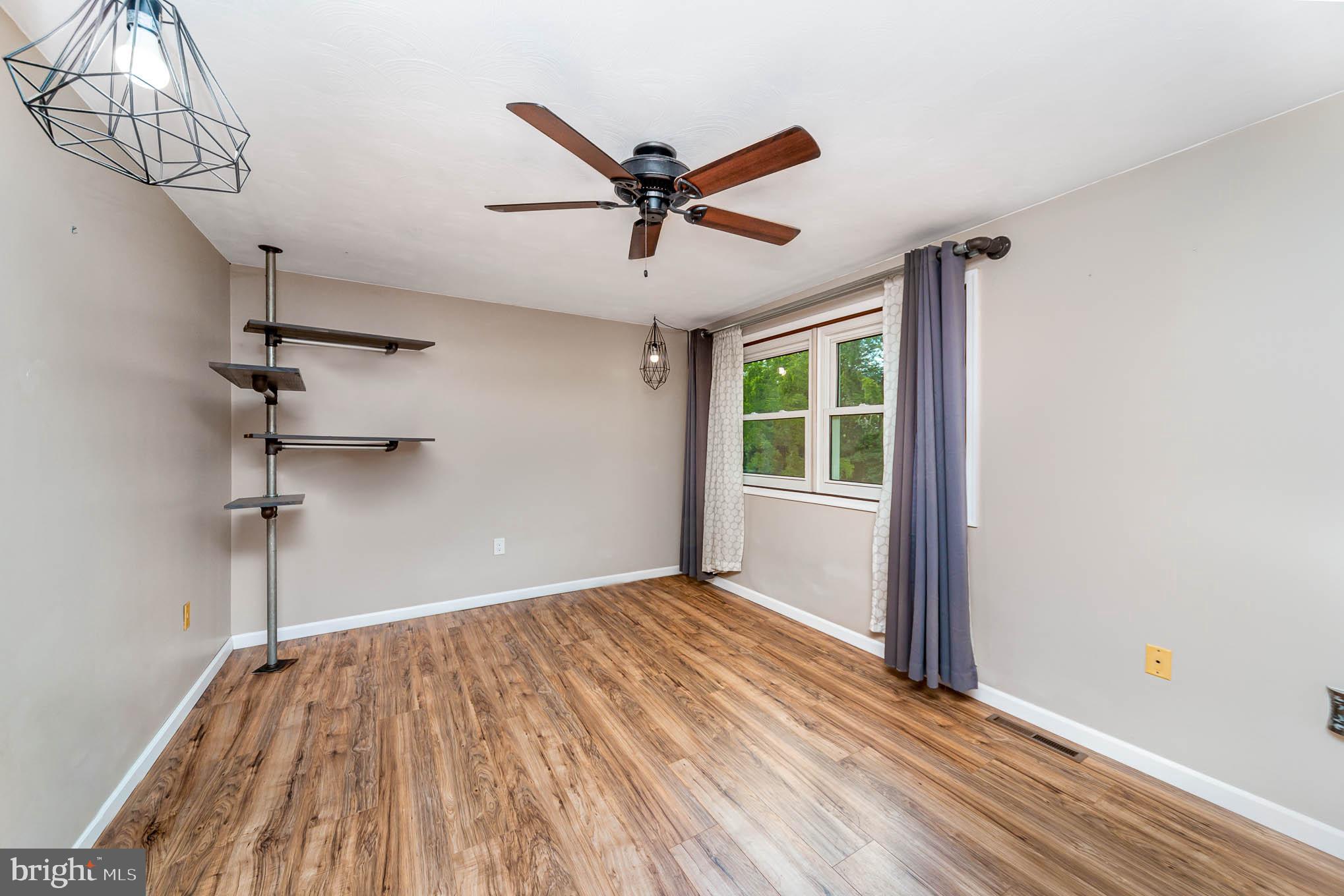 568 Valley Road Enola, PA 17025 - Photo 10 of 27 a view of a room with a ceiling fan and a window