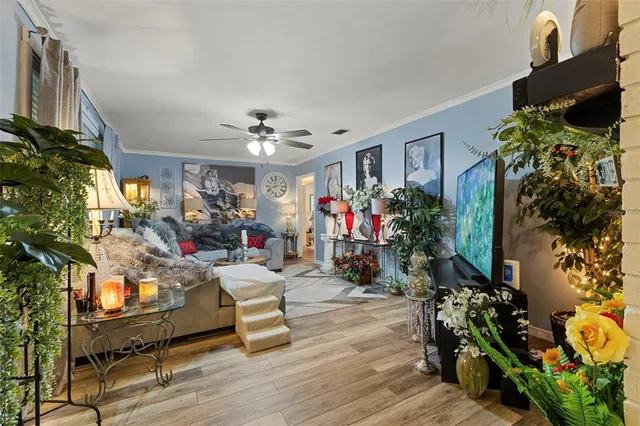 a living room filled with furniture and a chandelier