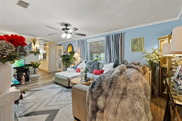 a living room filled with furniture and a chandelier