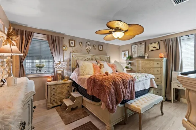 a bathroom with a granite countertop sink and a toilet