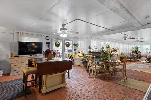 a view of a dining room with furniture and a window