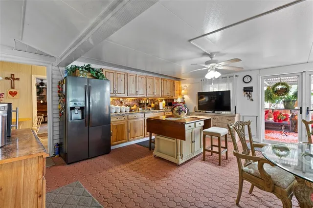 a kitchen with granite countertop a sink cabinets and stainless steel appliances