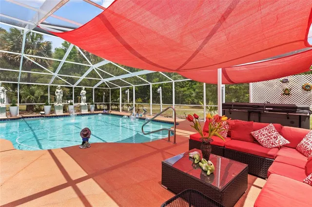 a view of a chairs and table in patio