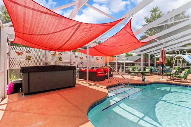 a view of a chairs and table in patio