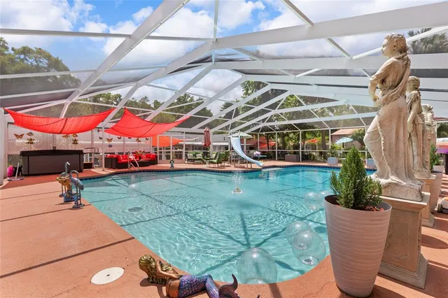 an outdoor space with lots of white furniture