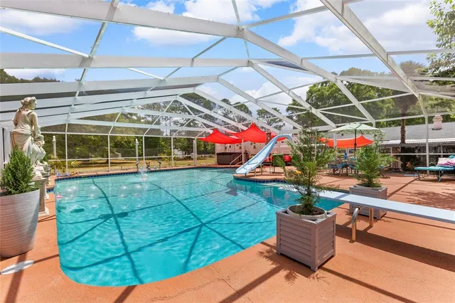 a living room with furniture and garden view