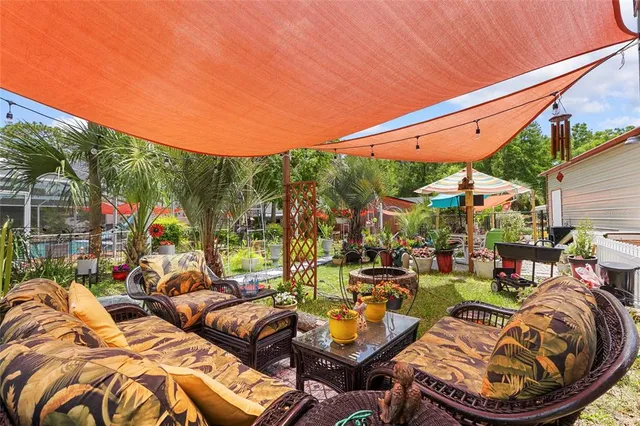 an aerial view of a houses with a yard