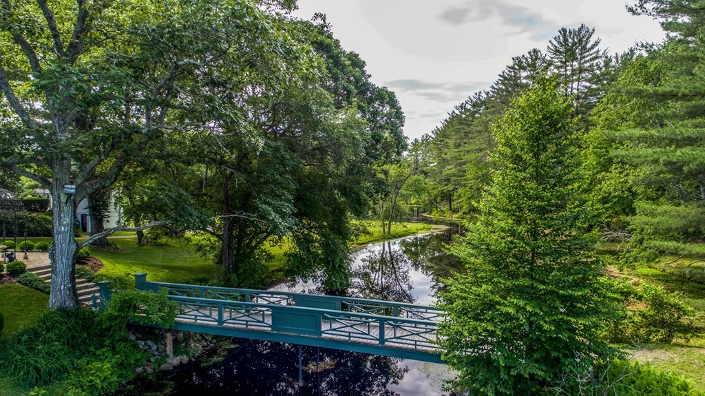 1075 Lowell Road Concord, MA 01742 - Photo 2 of 26 a view of a yard with wooden fence