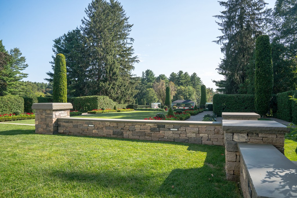 1075 Lowell Road Concord, MA 01742 - Photo 23 of 26 a view of a garden with swimming pool