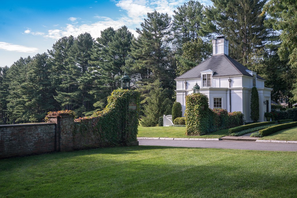 1075 Lowell Road Concord, MA 01742 - Photo 26 of 26 a front view of a house with a yard