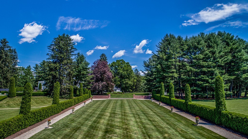 1075 Lowell Road Concord, MA 01742 - Photo 6 of 26 a view of a golf course with a lake view