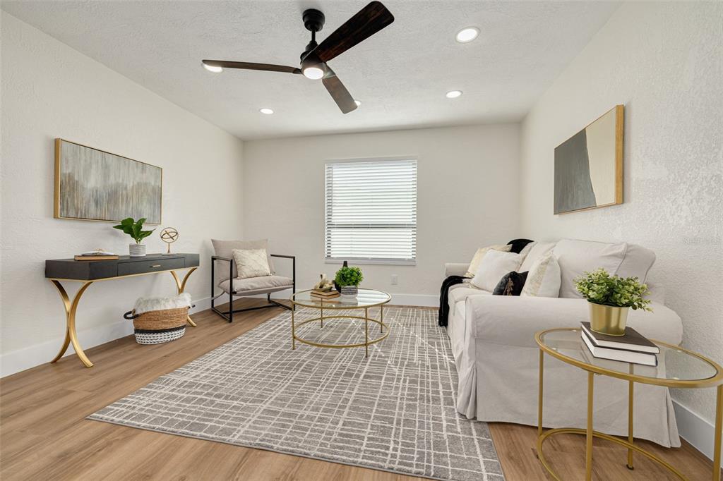 2034 58th Way North Clearwater, FL 33760 - Photo 14 of 35 a living room with furniture and a wooden floor